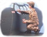 U.S. mechanic painting victory marks